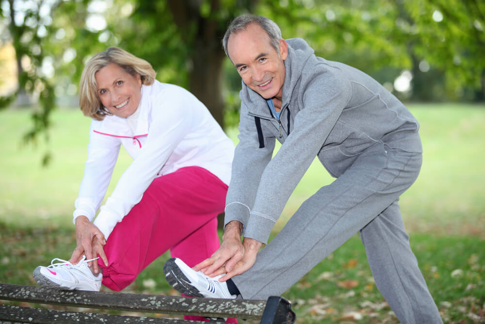 Man and woman stretching before a run